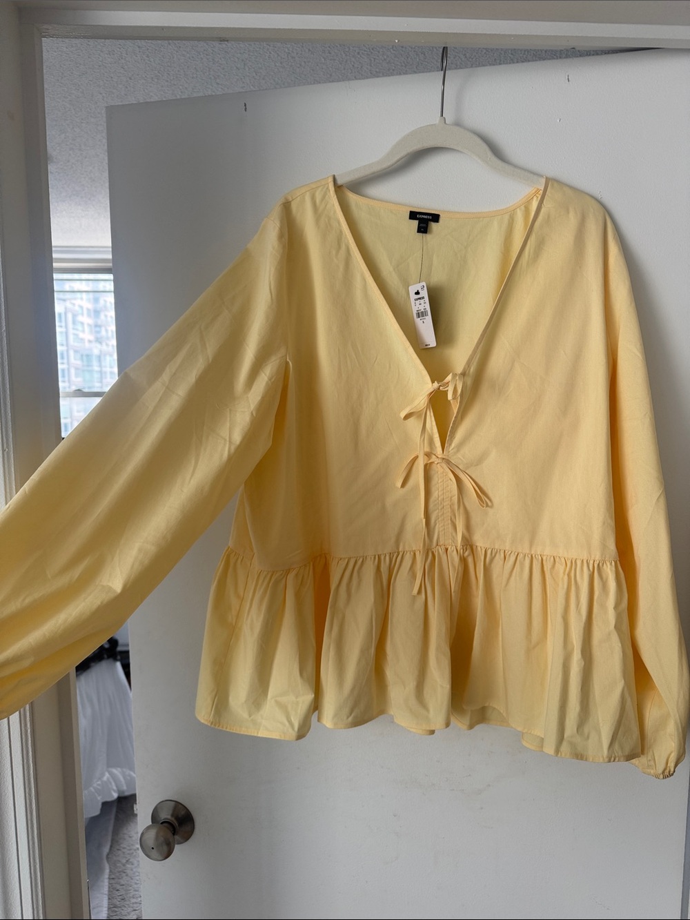 Express 
Flowy V-Neck Peplum Blouse with Tie Detail - Pale Yellow
